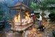 China: Lighting incense at the Nanhua Buddhist temple (Nanhua Si), near Shaoguan, Guangdong Province